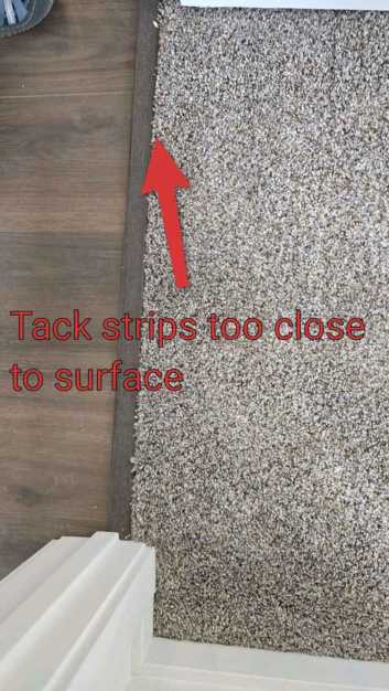 Carpet tack strip safety concern found during new construction inspection