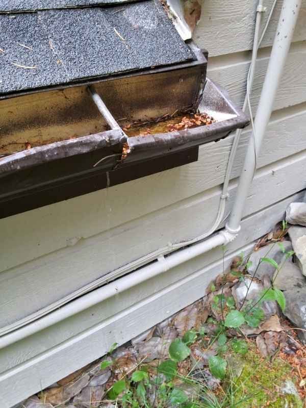 Damaged gutter and water-management concern documented during inspection
