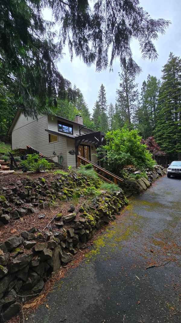 1980s Hayden-area lake house exterior and drainage context
