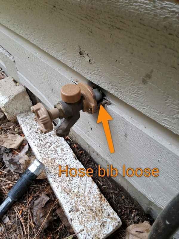 Loose exterior hose bib connection documented during plumbing inspection